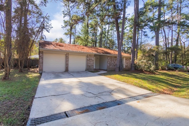 ranch-style house with a garage and a front lawn