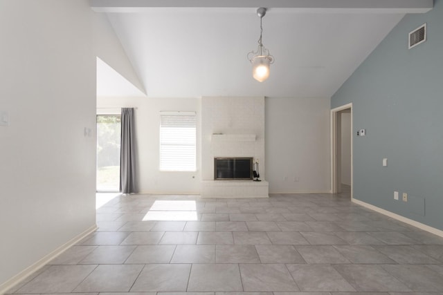 unfurnished living room featuring vaulted ceiling with beams, light tile patterned floors, and a brick fireplace