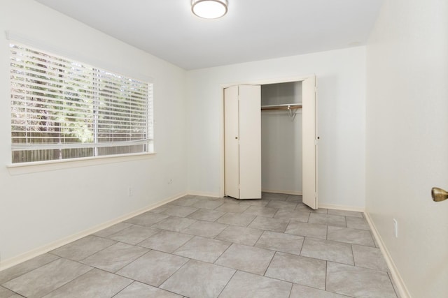 unfurnished bedroom with a closet