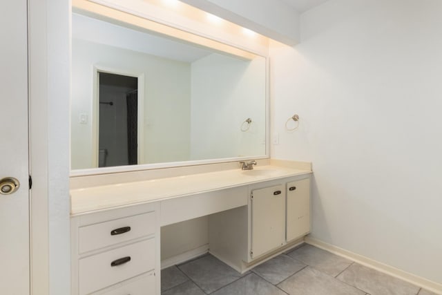 bathroom featuring tile patterned floors and vanity