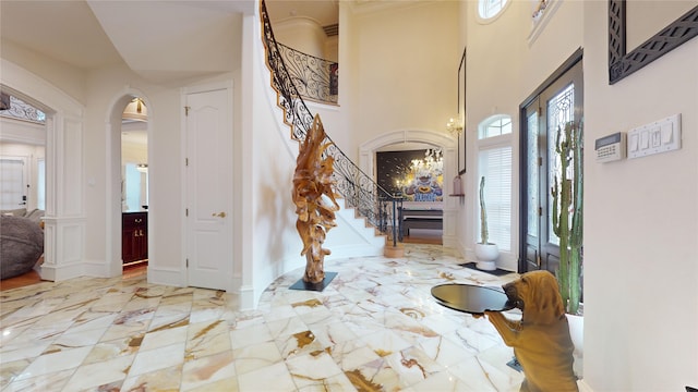 foyer featuring a chandelier