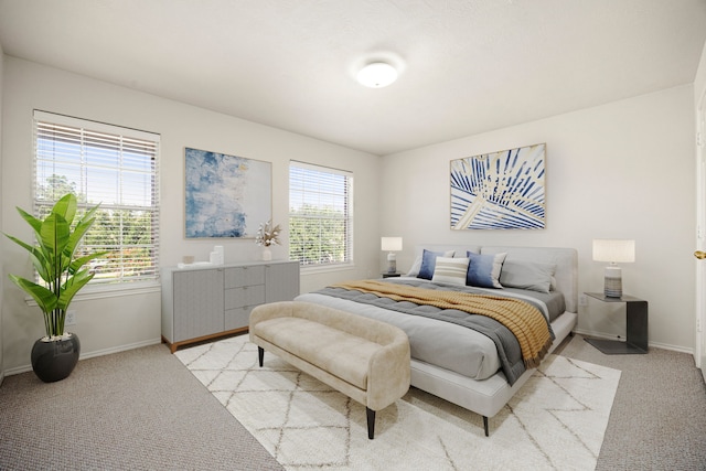 bedroom featuring light colored carpet