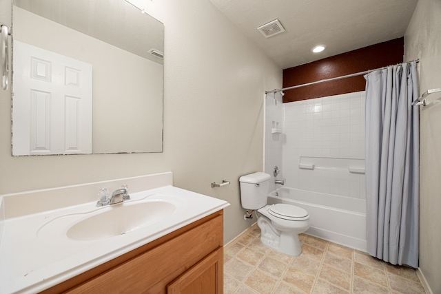 full bathroom featuring vanity, toilet, and shower / tub combo