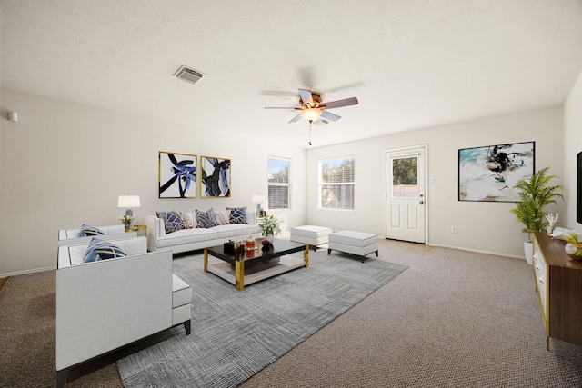 living room with carpet floors and ceiling fan