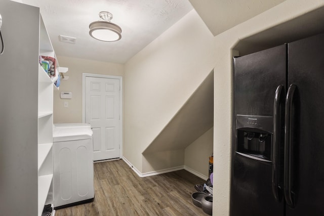 washroom with washer / dryer and wood-type flooring