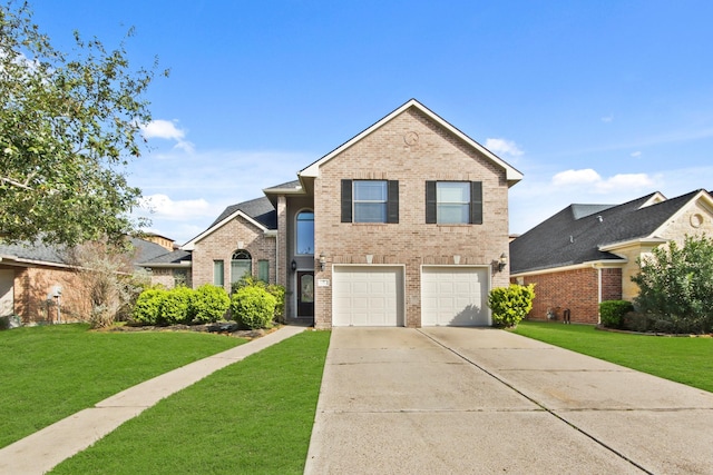 view of property featuring a front yard and a garage