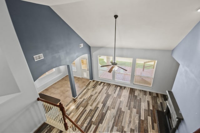 additional living space featuring lofted ceiling, ceiling fan, and wood-type flooring