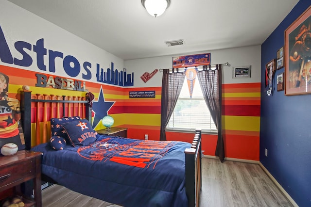 bedroom with wood-type flooring