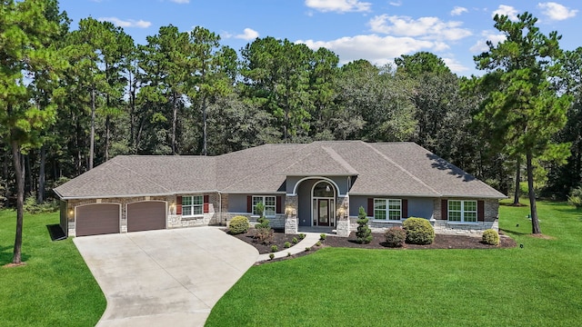 single story home with a garage and a front lawn