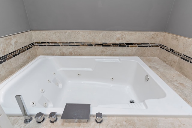 bathroom with tiled bath