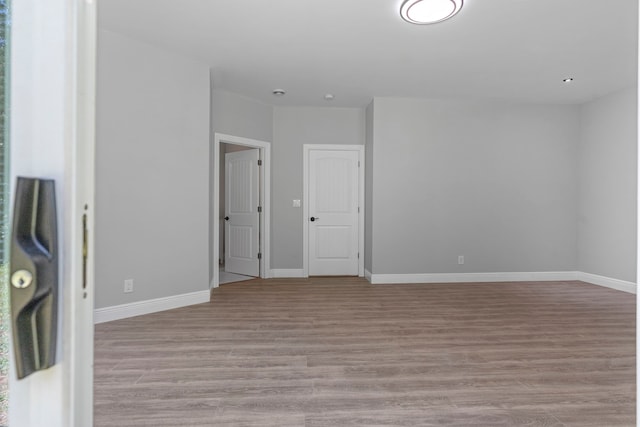 spare room featuring light hardwood / wood-style floors