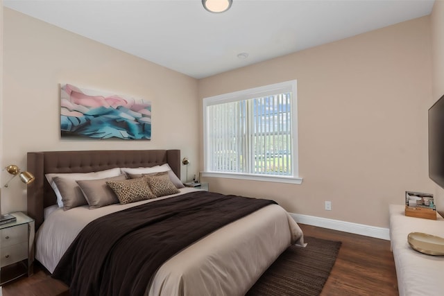 bedroom featuring dark wood-type flooring