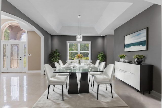 dining room with a tray ceiling