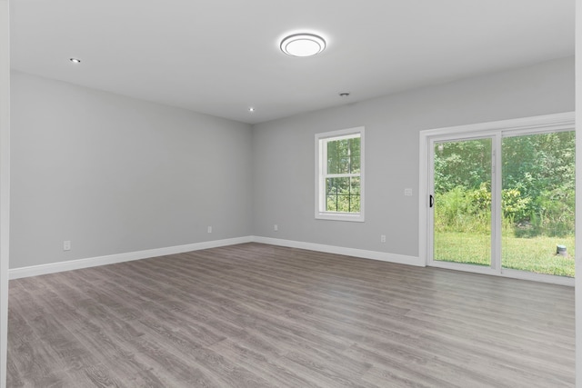 unfurnished room featuring light hardwood / wood-style floors