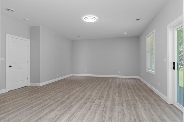 unfurnished room with light hardwood / wood-style floors