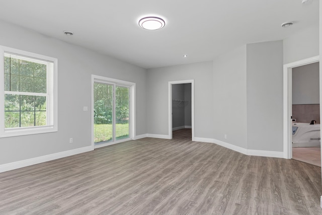 unfurnished room featuring light wood-type flooring