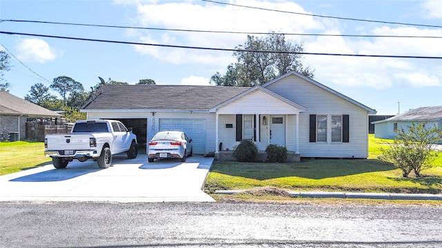 view of front of property with a garage, driveway, and a front yard