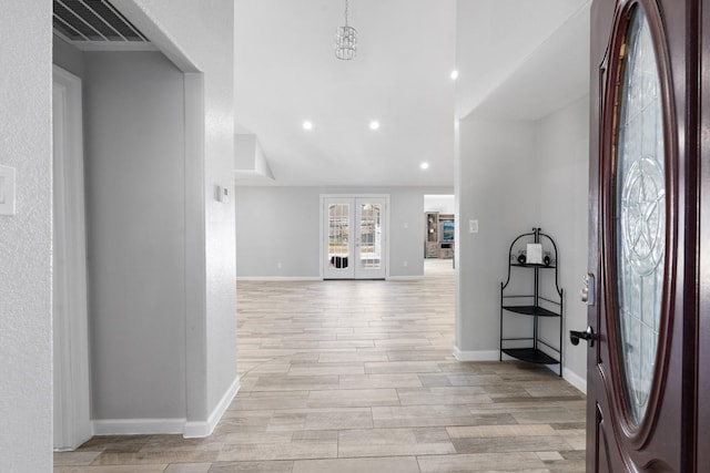 entrance foyer featuring vaulted ceiling