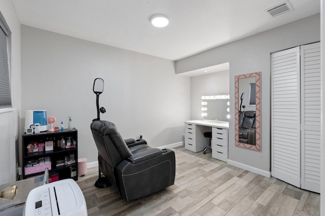 sitting room with light wood-type flooring