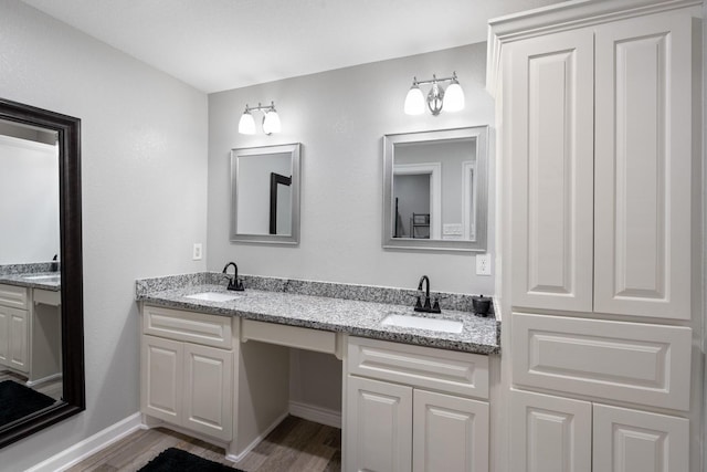 bathroom featuring hardwood / wood-style floors and vanity