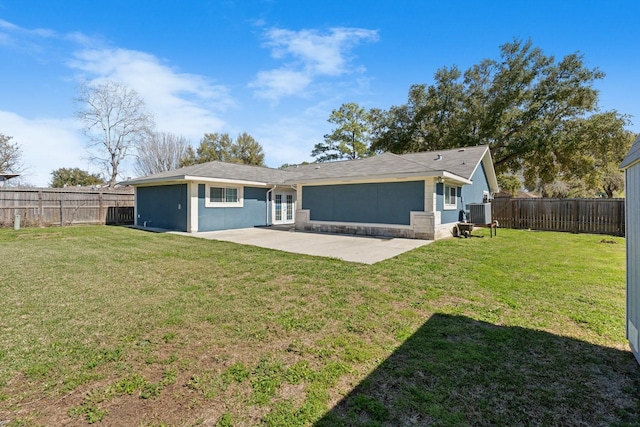 back of house with a patio, cooling unit, and a lawn