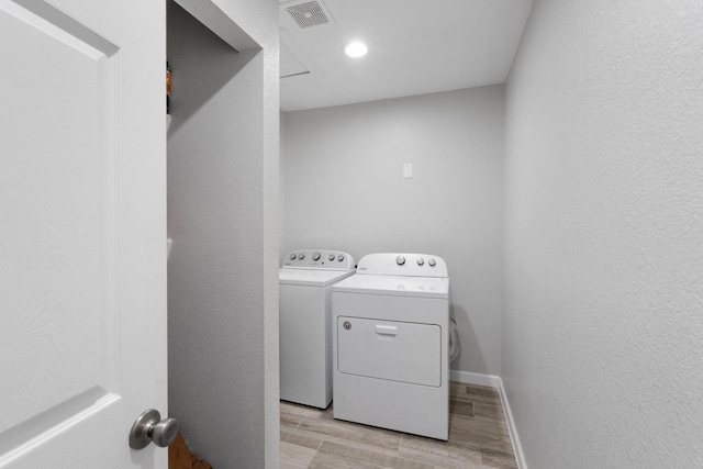 washroom featuring washer and clothes dryer