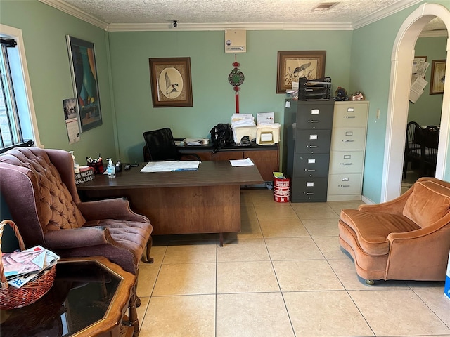 tiled office space featuring ornamental molding and a textured ceiling