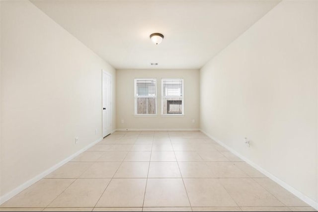 empty room with light tile patterned floors