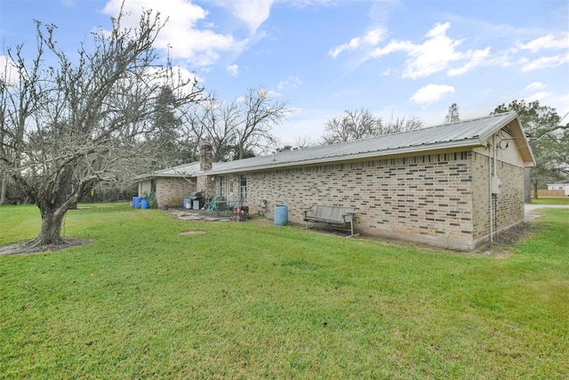 rear view of house with a yard