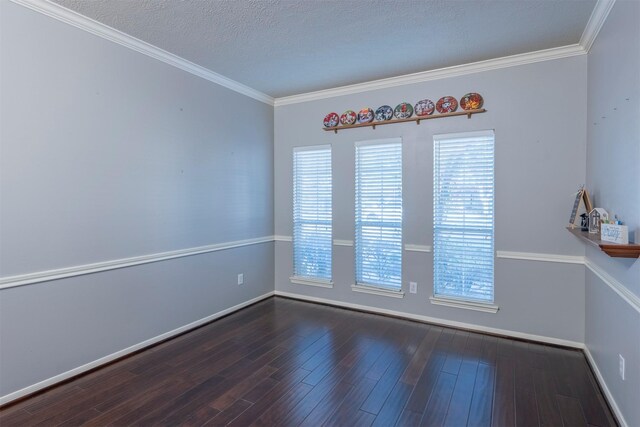 unfurnished room featuring dark hardwood / wood-style floors, a textured ceiling, and a wealth of natural light