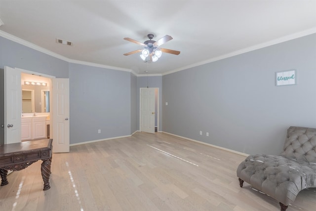 living area with ceiling fan, ornamental molding, and light wood-type flooring