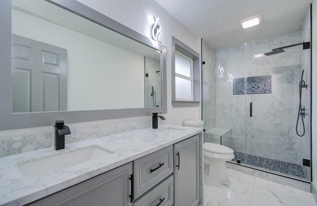 bathroom with toilet, walk in shower, and vanity