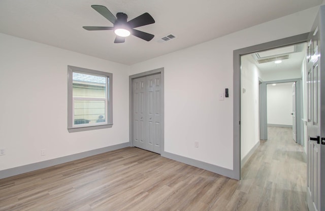 unfurnished bedroom with a closet, ceiling fan, and light hardwood / wood-style floors