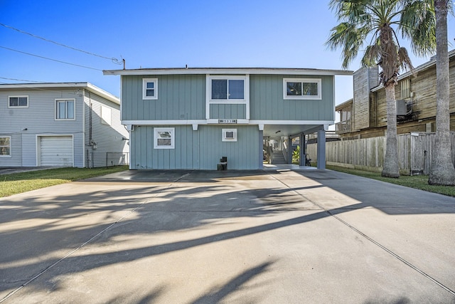 rear view of house featuring a carport