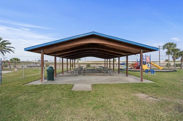 view of community featuring a playground and a yard