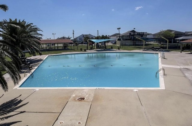 view of swimming pool featuring a patio area