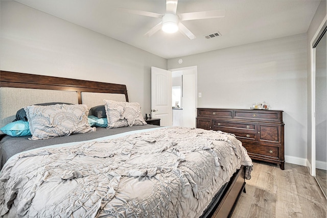 bedroom with ceiling fan and light hardwood / wood-style floors