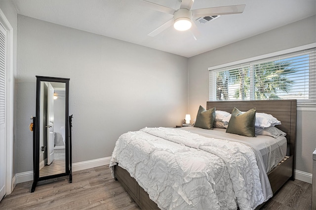 bedroom featuring hardwood / wood-style floors and ceiling fan