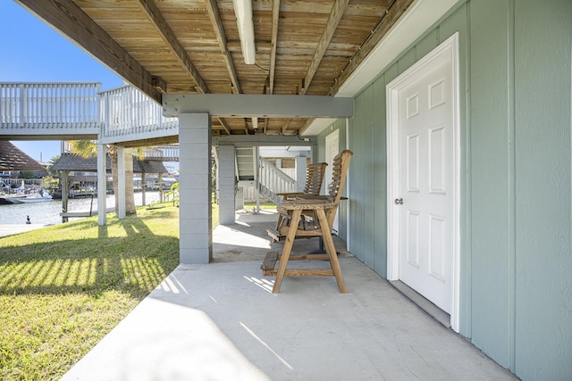 view of patio / terrace featuring a deck with water view