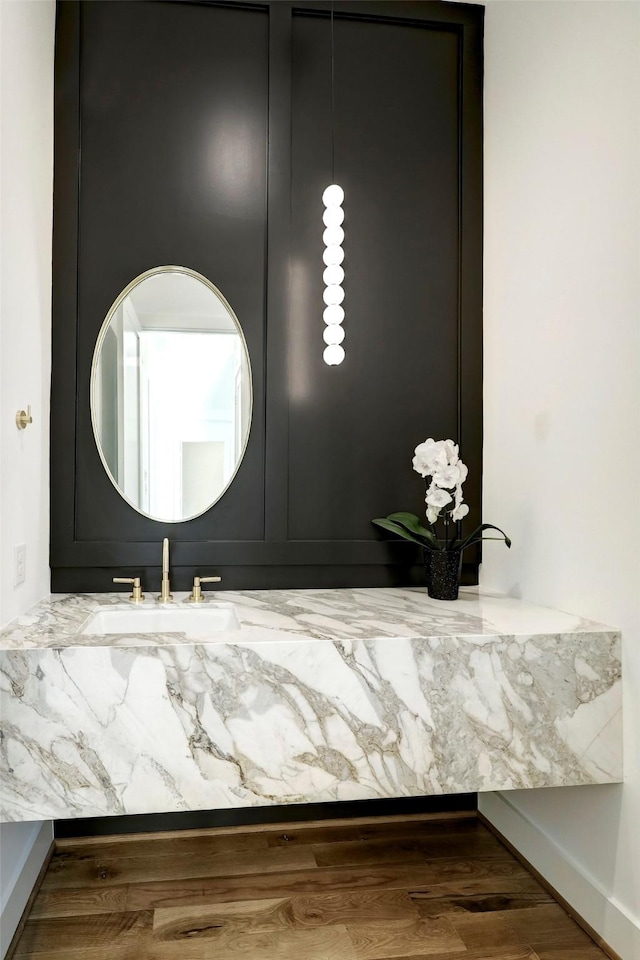 bathroom featuring hardwood / wood-style flooring and sink