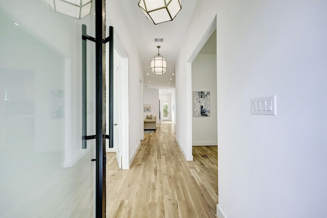 hallway featuring light wood-type flooring