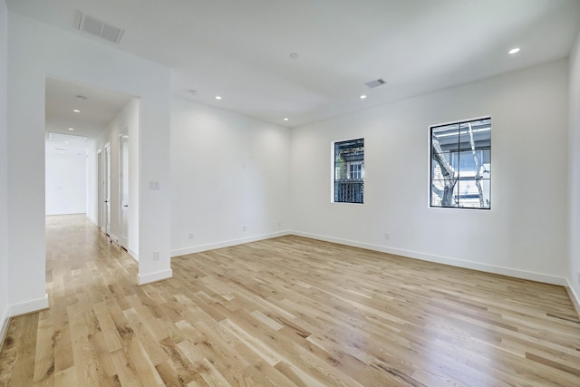 spare room featuring light hardwood / wood-style floors