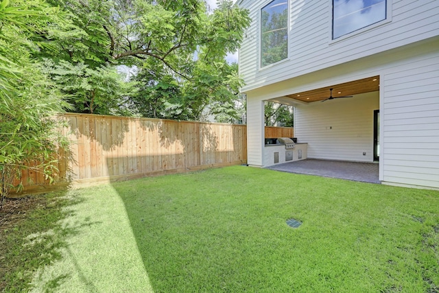 view of yard featuring area for grilling and a patio