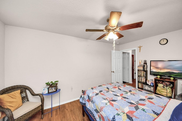 bedroom featuring hardwood / wood-style floors and ceiling fan