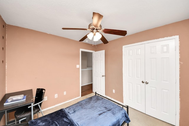 bedroom with ceiling fan and a closet