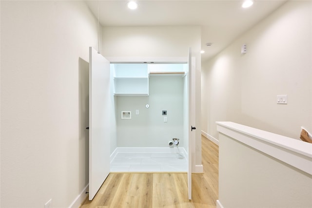 corridor with light hardwood / wood-style floors