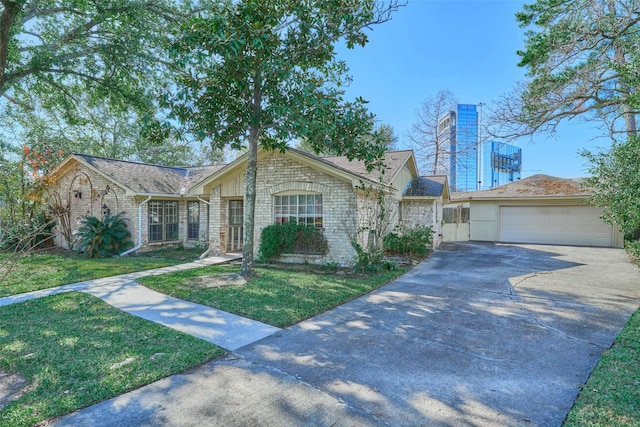 ranch-style home featuring a garage and a front lawn