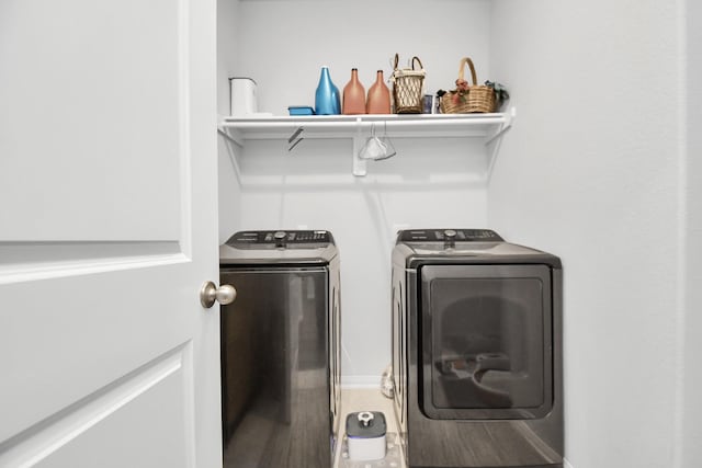 clothes washing area featuring washer and dryer