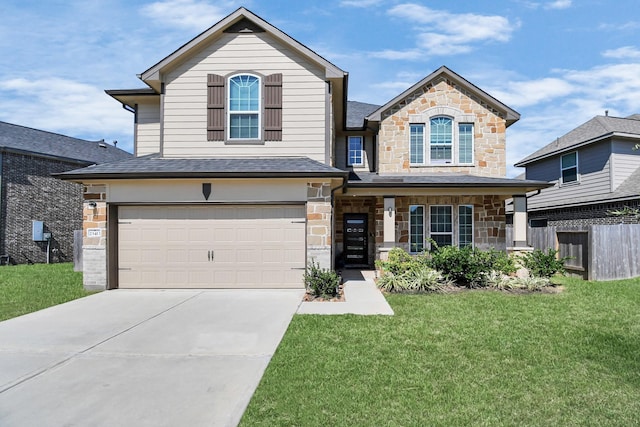 view of front of house featuring a front yard and a garage