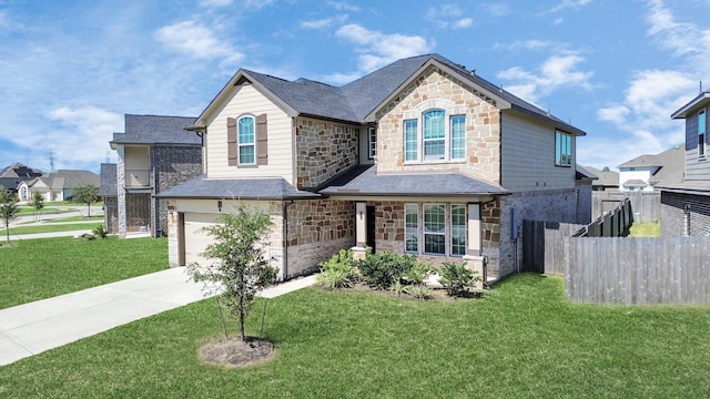 view of front of house with a front lawn and a garage